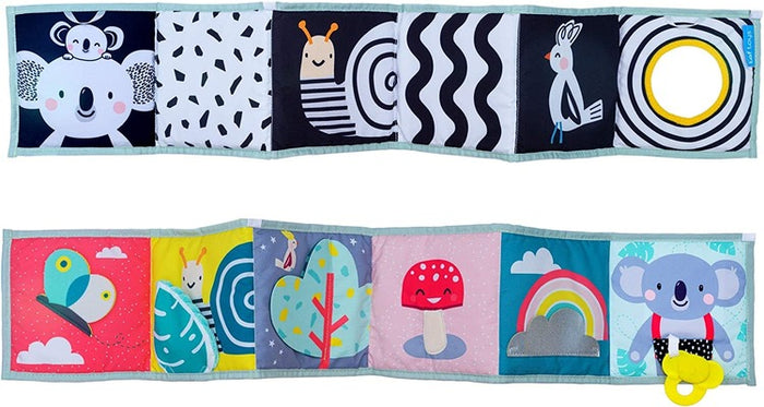 Double-sided soft book with high-contrast black and white animal patterns and a colorful side with nature scenes.