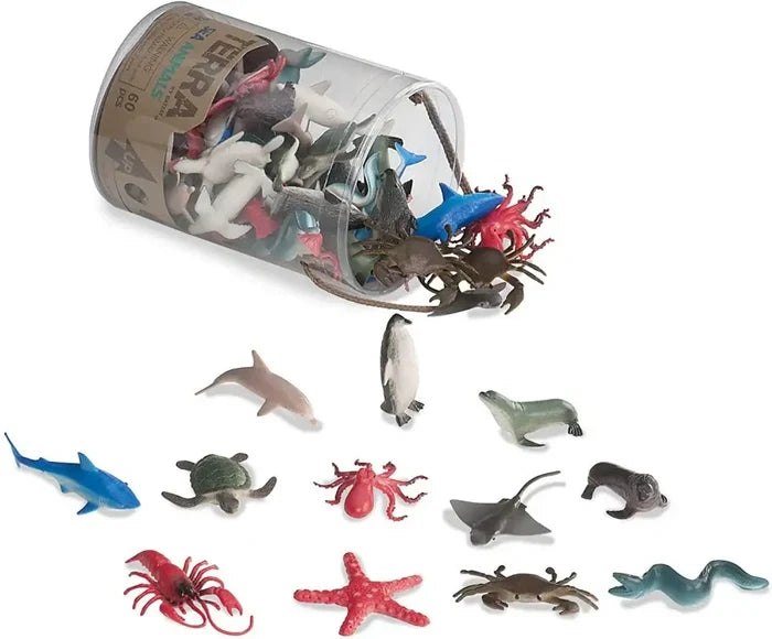 Assorted toy sea animals spilling from a clear plastic tube, including a blue shark, red octopus, and green turtle.