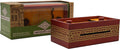 Dark red wooden puzzle box with gold fret patterns and sliding pegs, shown next to its green retail packaging.