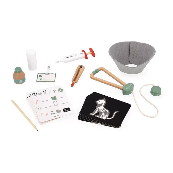 Wooden toy vet kit with stethoscope, syringe, thermometer, grey pet cone, medicine bottle, and animal X-ray cards.