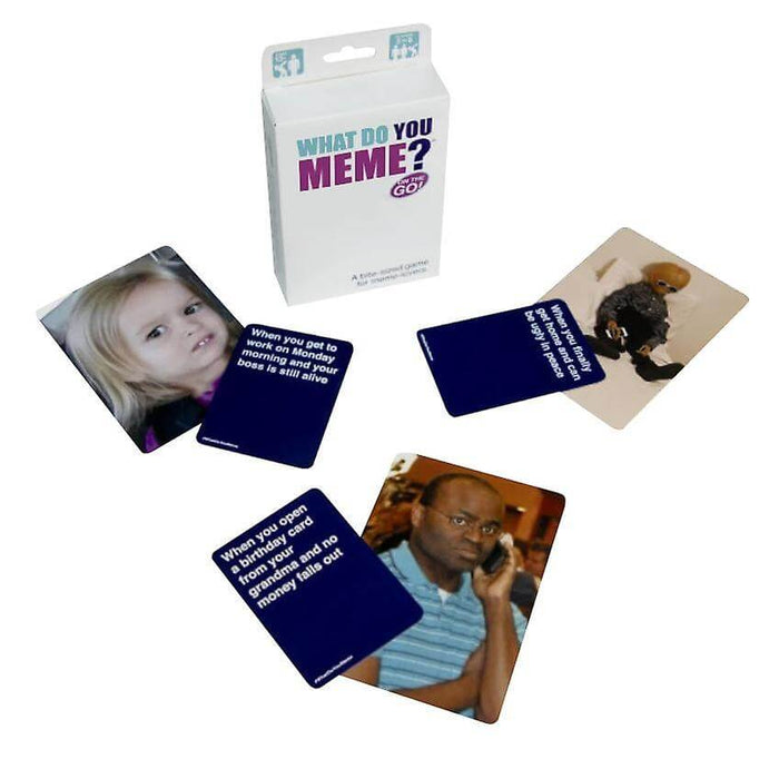 White What Do You Meme? On the Go box with three pairs of meme photo cards and dark blue caption cards.