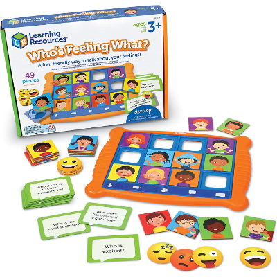 Orange game board with illustrated child face cards, green prompt cards, and emoji discs shown with the product box.