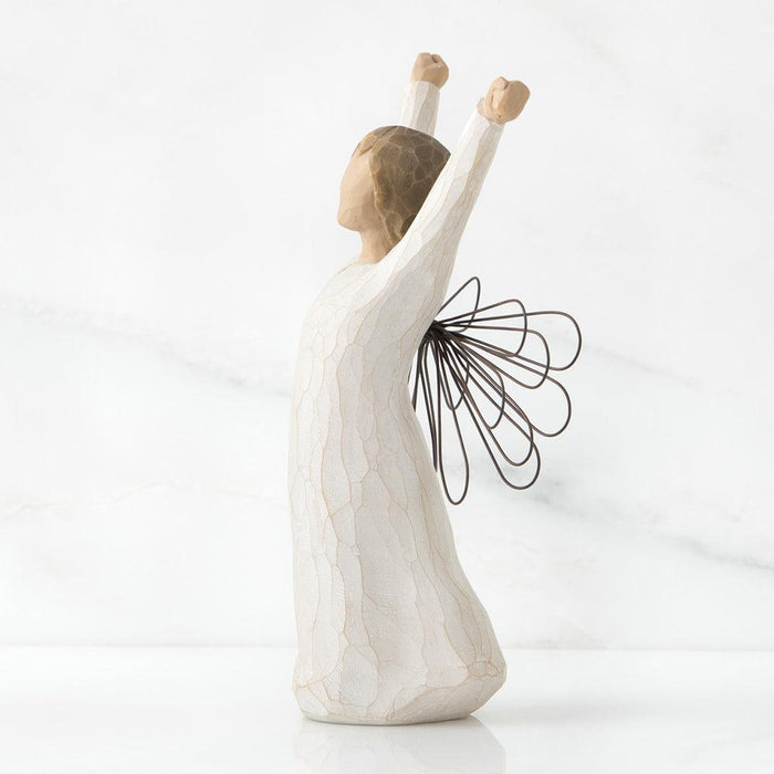 Statue of a person with outstretched arms and a black abstract design on a white background