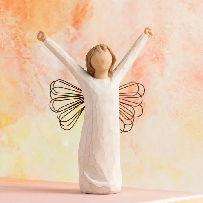 Decorative figurine of a woman with outstretched arms against a pastel background