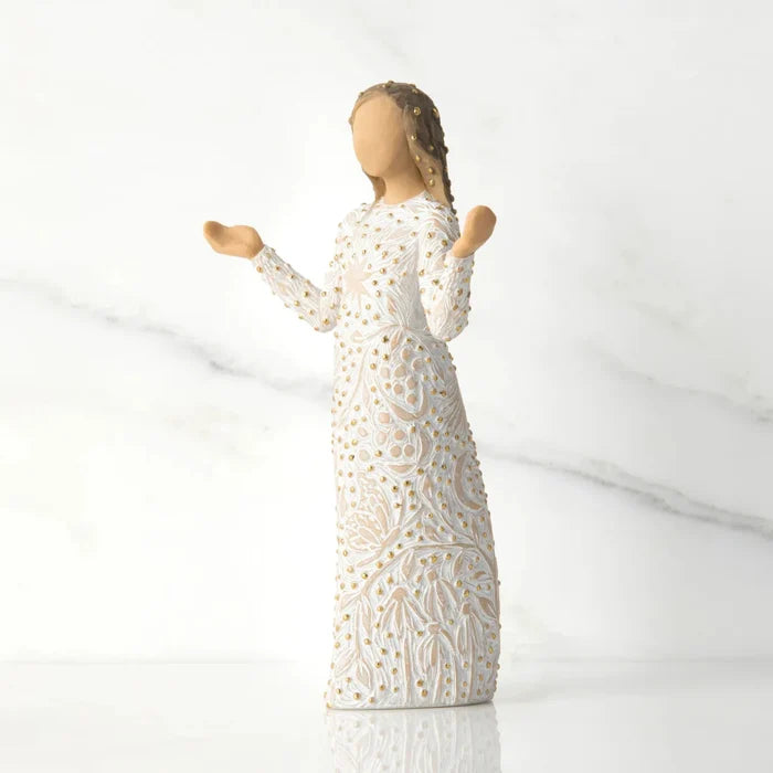 Statue of a woman in a white dress with a textured pattern on a light gray background