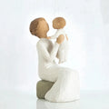 Willow Tree Grandmother figurine holding a baby on a white background