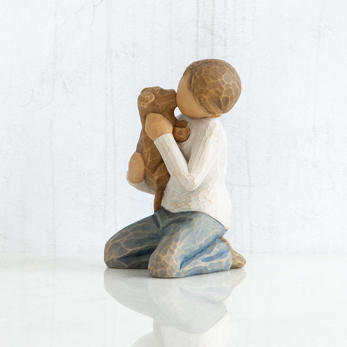 figurine of a couple embracing on a white background