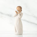 White figurine of a woman holding a delicate heart  on a white background