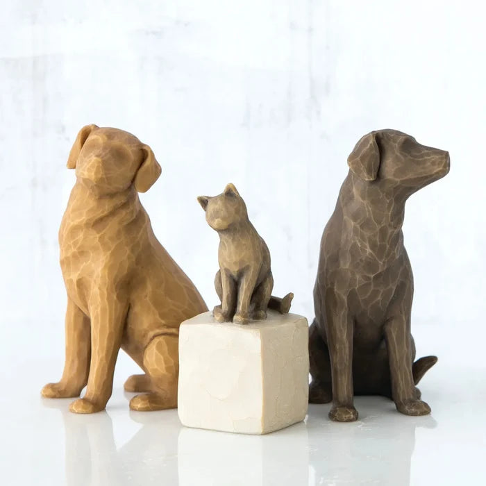 Three brown pet statues on a white background
