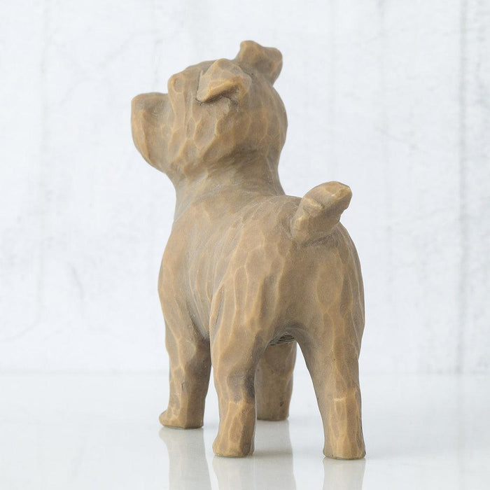 Ceramic dog figurine on a white background