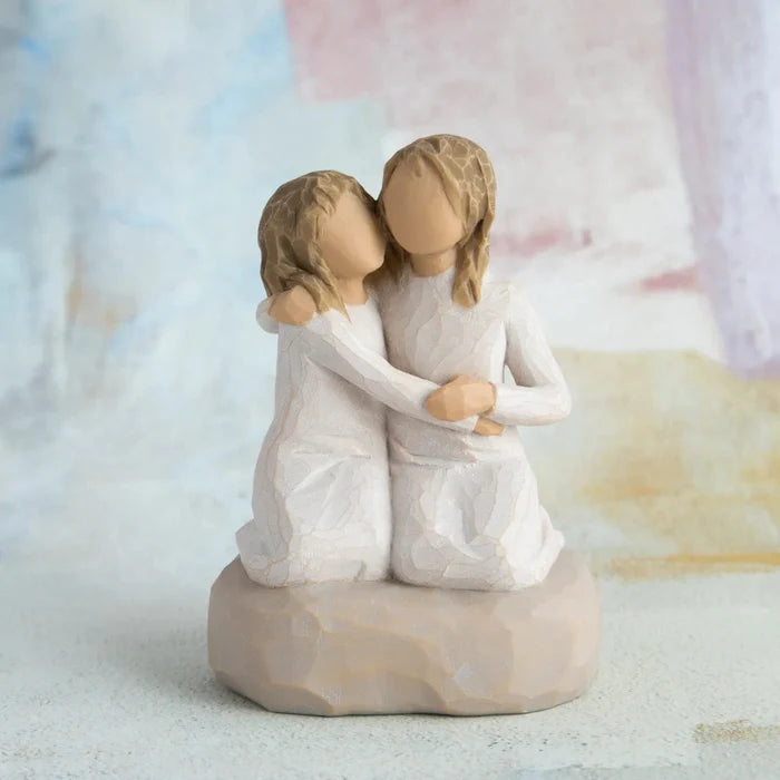 Willow Tree Sister Mine figurine showing two sisters sitting together om a water color background
