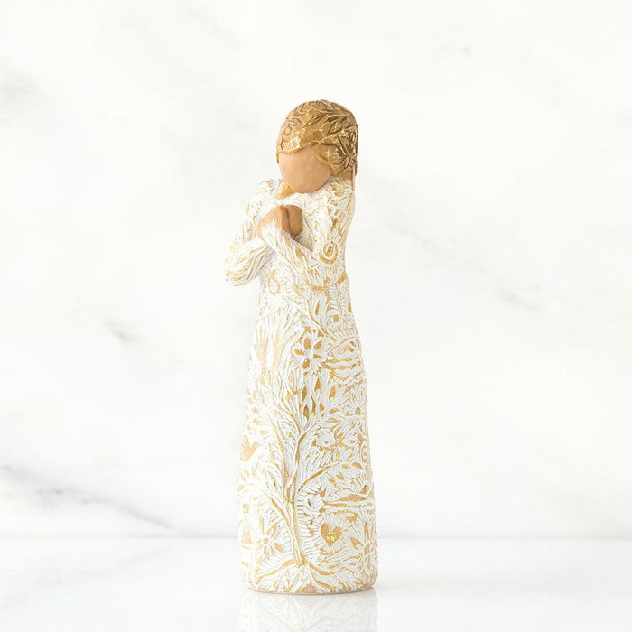 Decorative figurine with intricate patterns on a white background