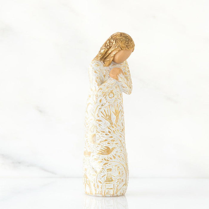 Decorative figure  with gold and white floral patterns on a white background