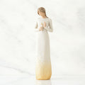 Decorative vase with a gradient design from white to gold on a white background