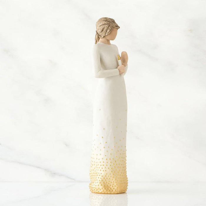 Decorative vase with gradient design from white to gold on a white background