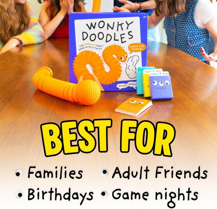 Blue game box with orange worm art, flexible accordion drawing tool, and colorful cards on a table with text overlay.